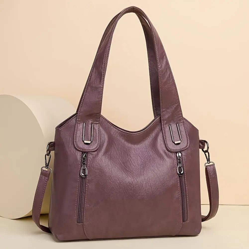 Sac à bandoulière Lydia Danoir Paris avec charme vintage, en cuir brun clair et détails élégants, vue de face.