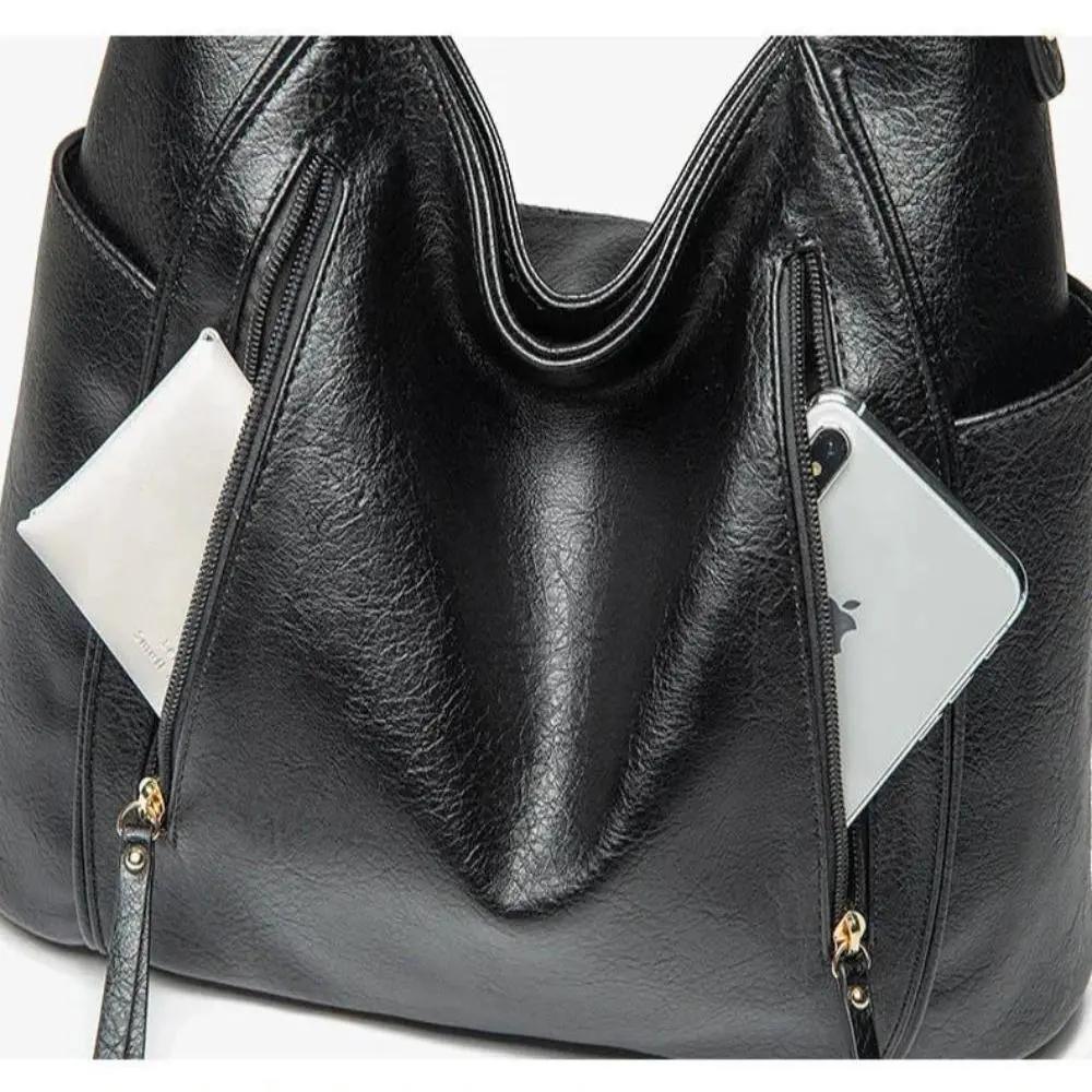 Sac Danoir Paris Lylia, élégant, intemporel, en cuir avec poignées et fermeture métallique, vue de face.