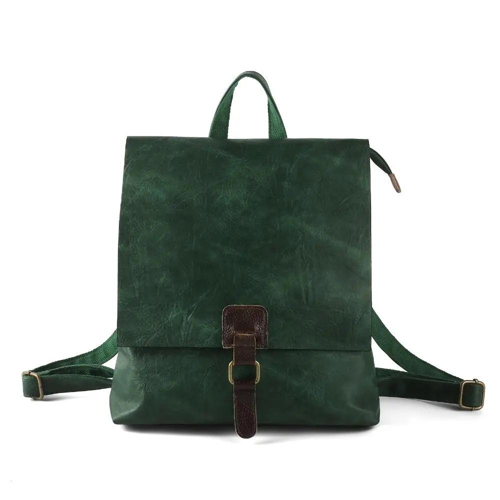 Sac à dos Danoir Paris Nina, style vintage, en cuir brun avec poches et bretelles réglables, prêt à compléter un look tendance.