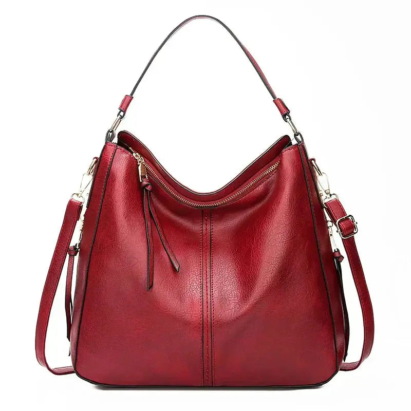 Sac élégant Romy en cuir de Danoir Paris, sac à main noir avec poignées en cuir et détails sophistiqués.