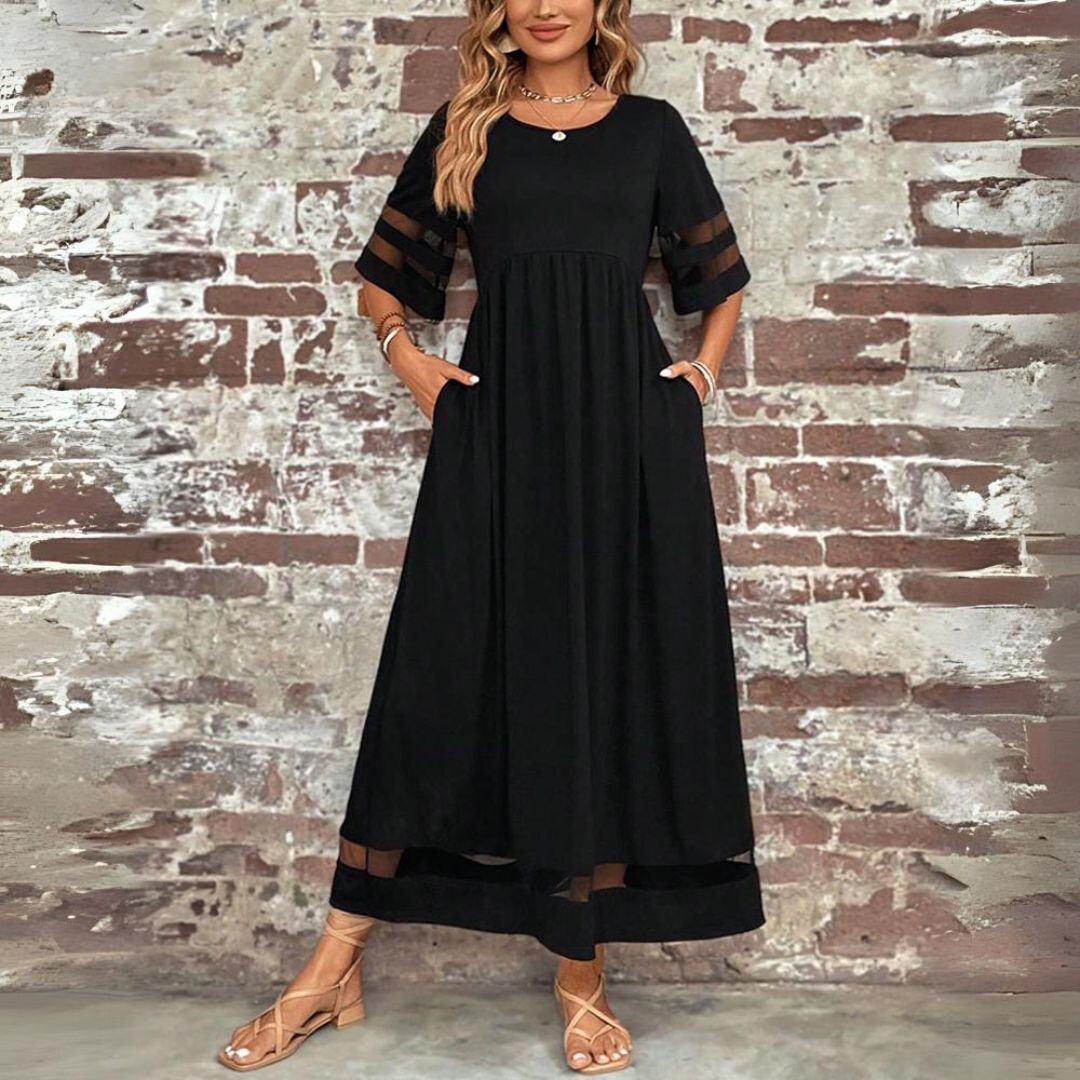 Robe midi Danoir Paris Cerelia, coupe flatteuse et amincissante, tissu élégant et ajusté, portée avec des détails sophistiqués.