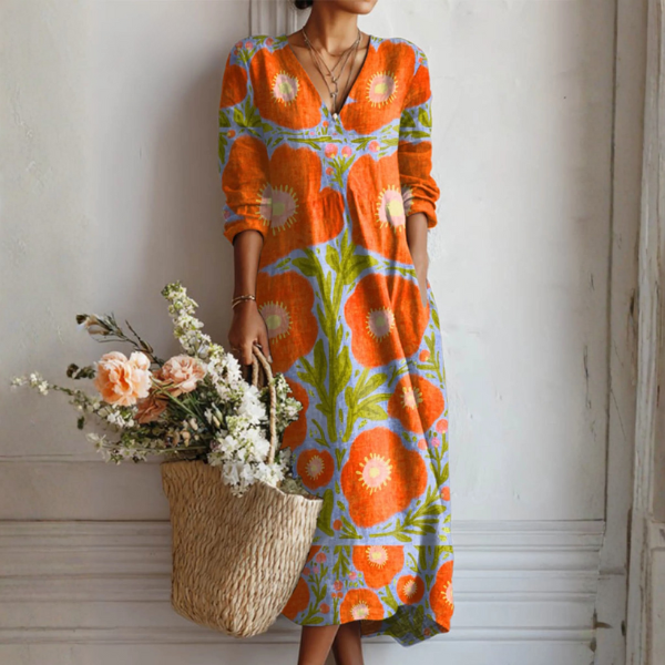 Robe florale enchantée Claire™ de Danoir Paris avec motifs floraux colorés et coupe élégante, vue de face sur mannequin.