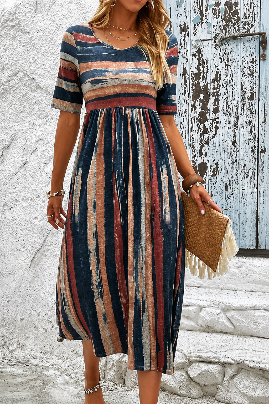 Robe midi rayée camouflage du ventre Noèle par Danoir Paris, tissu léger avec motifs noirs et blancs, ajustée à la taille.
