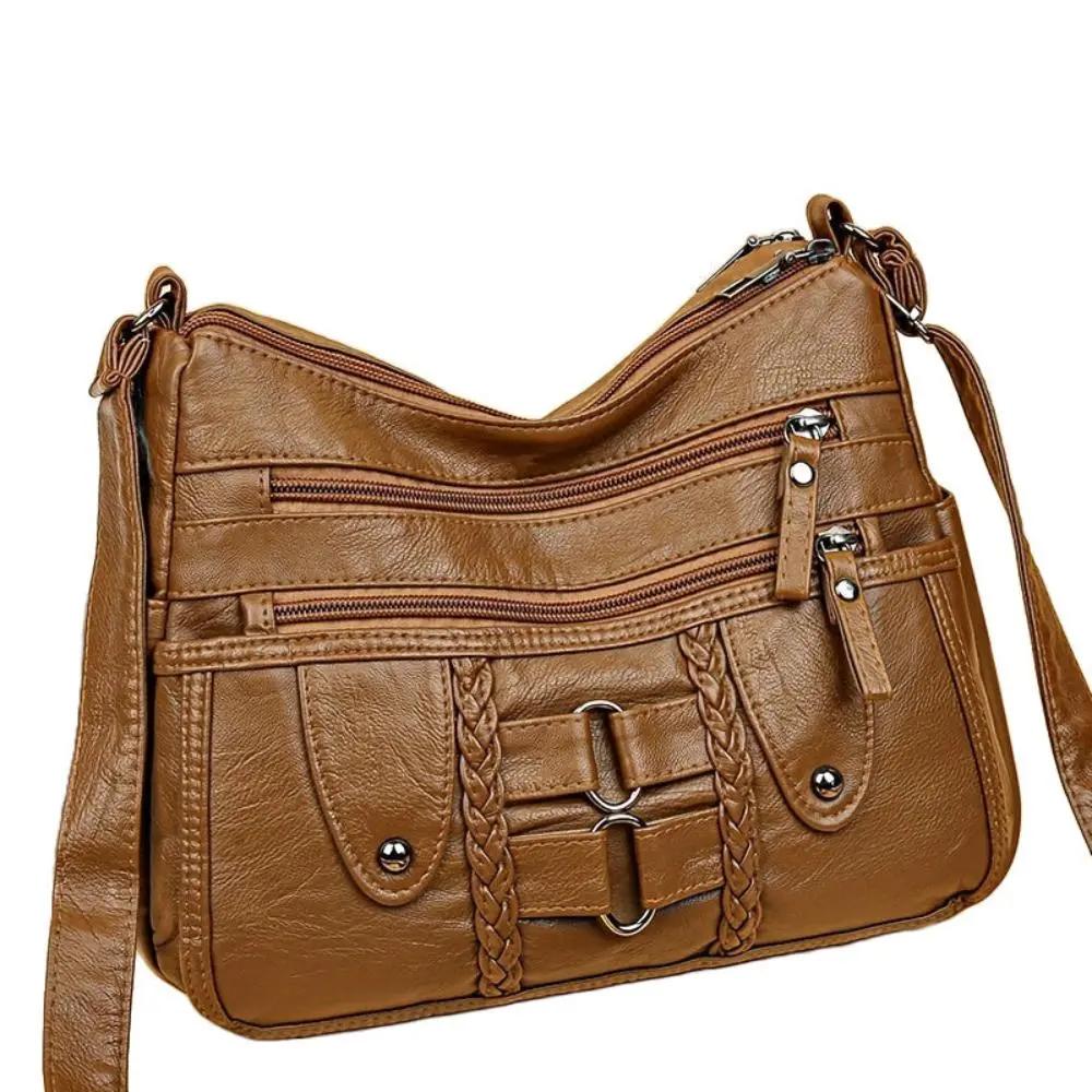 Sac bandoulière Danoir Paris Ivy sécurisé, en cuir avec fermeture et compartiments visibles, design élégant et pratique.
