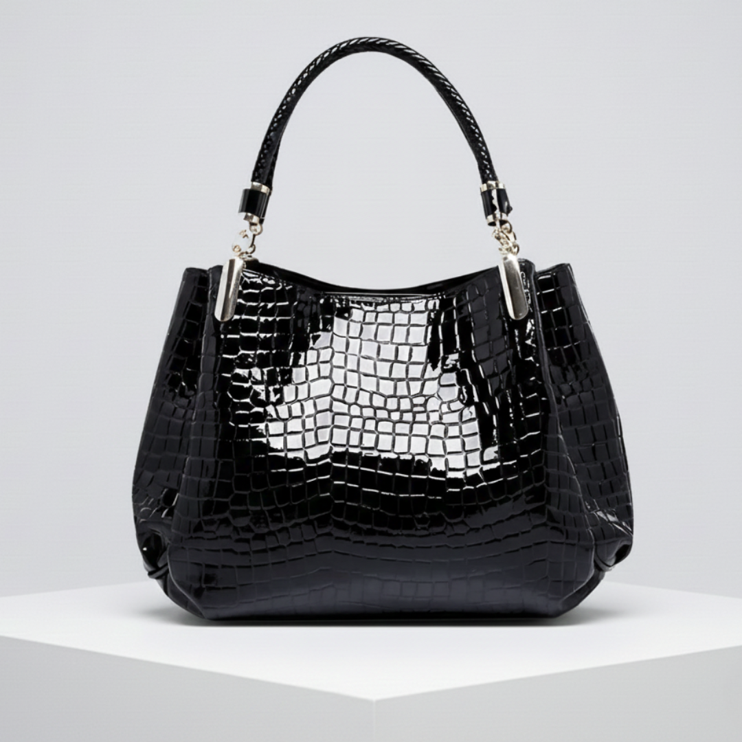 Sac à main en crocodile noir Lusso Milano de Danoir Paris, avec poignée élégante et finition sophistiquée.