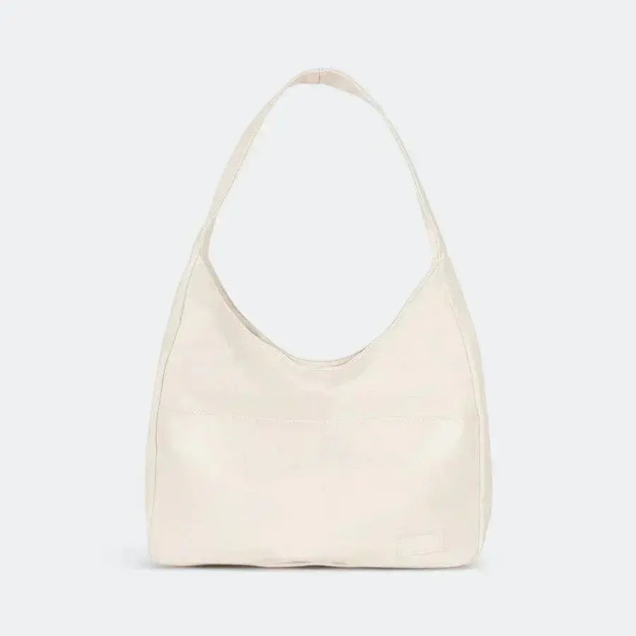 Sac cabas Danoir Paris Nina en cuir noir avec poignées épaisses et design simple pour le quotidien.