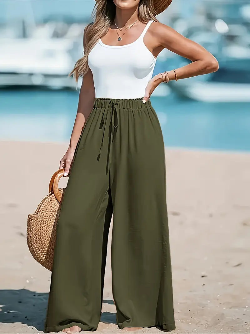 Pantalons taille haute élégants de la marque Danoir Paris, coupe ajustée et tissu sophistiqué, pour un style chic et moderne.