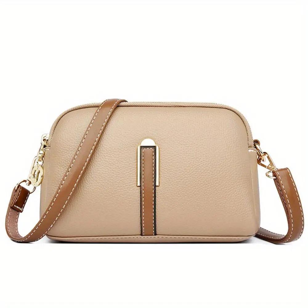 Sac bandoulière Sienna de Danoir Paris, en cuir élégant avec détails de style, visible avec poignée et bandoulière ajustable.