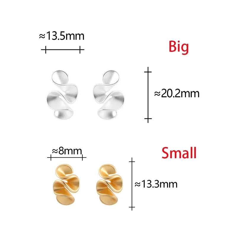 Boucles d'oreilles en argent et or 18K de Danoir Paris, finition élégante et raffinée, visibles en détail sur l'image.