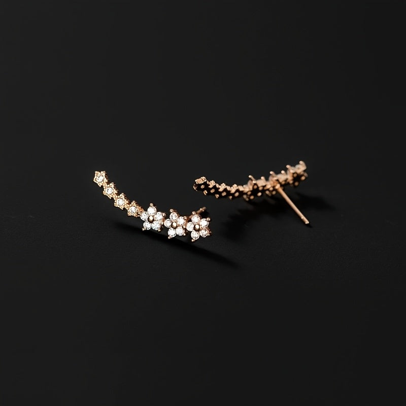 Boucles d'oreilles florales intemporelles Danoir Paris avec motifs délicats en or et détails floraux élégants.