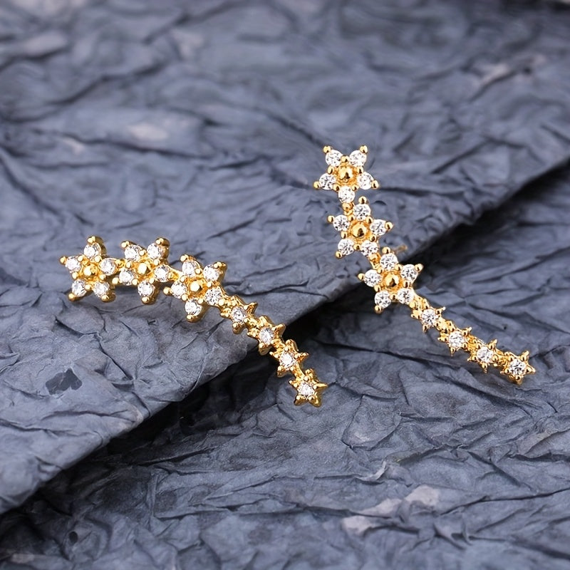 Boucles d'oreilles florales intemporelles de Danoir Paris avec motifs délicats en or et rose, élégantes et féminines.