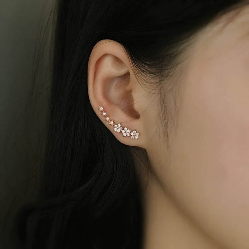 Boucles d'oreilles en fleurs Danoir Paris, design intemporel avec motifs floraux élégants en or rose.
