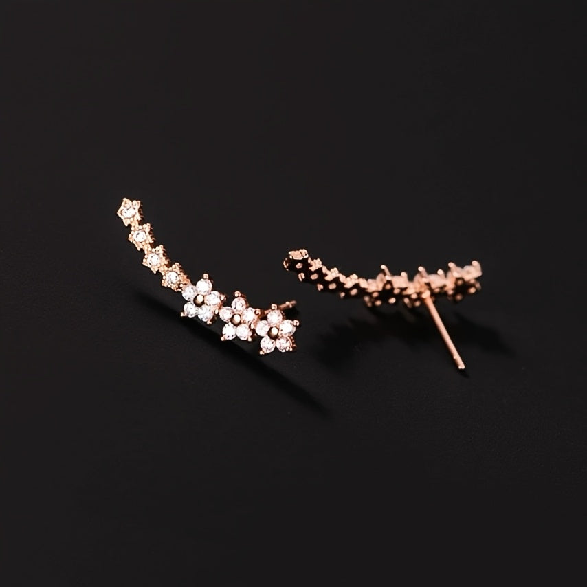 Boucles d'oreilles intemporelles en fleurs Danoir Paris, or rose, avec motif floral élégant et délicat.