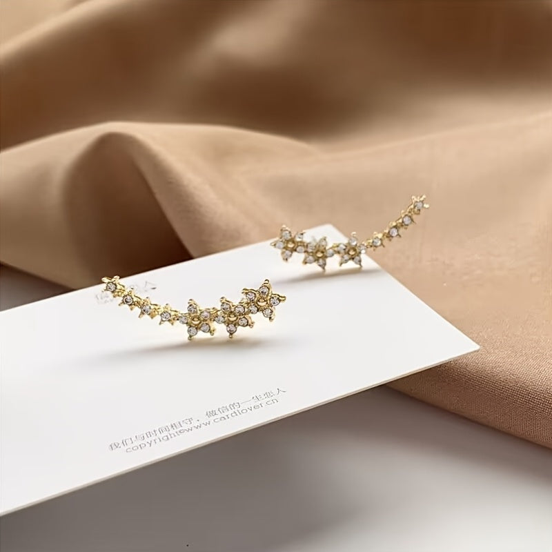 Boucles d'oreilles intemporelles en fleurs Danoir Paris, or rose, avec motifs floraux élégants et délicats.