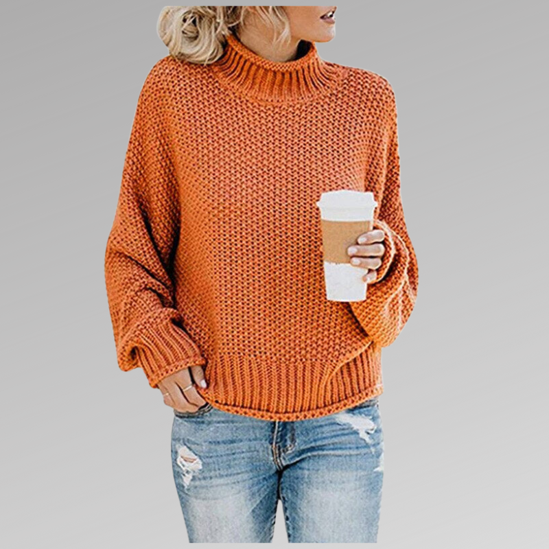 Pull décontracté élégant Danoir Paris Helena en orange porté, montrant le style confortable et sophistiqué du vêtement.