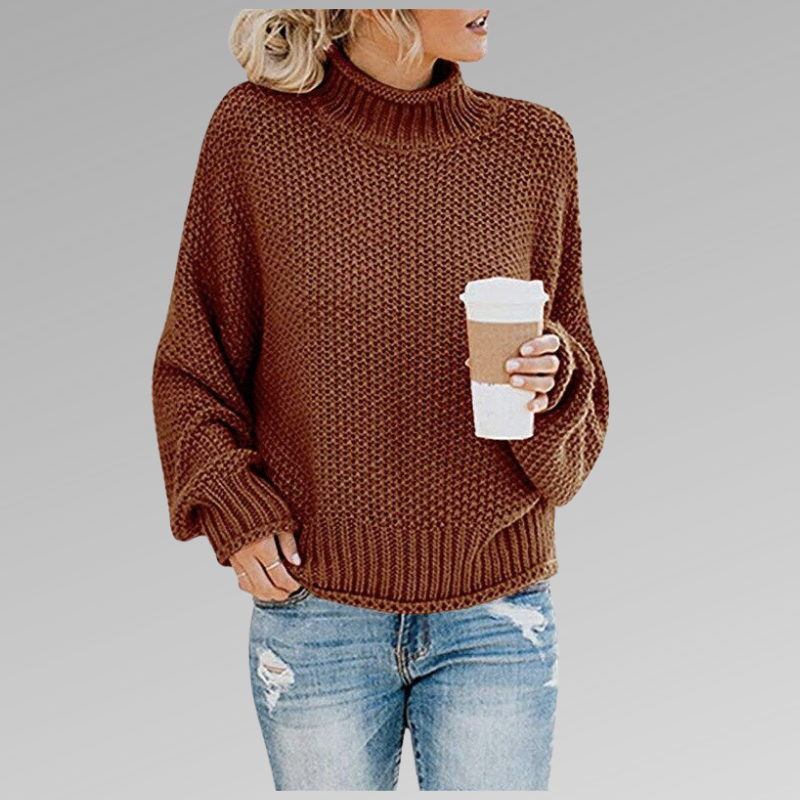 Pull décontracté élégant Danoir Paris Helena de couleur orange, porté en gros plan.
