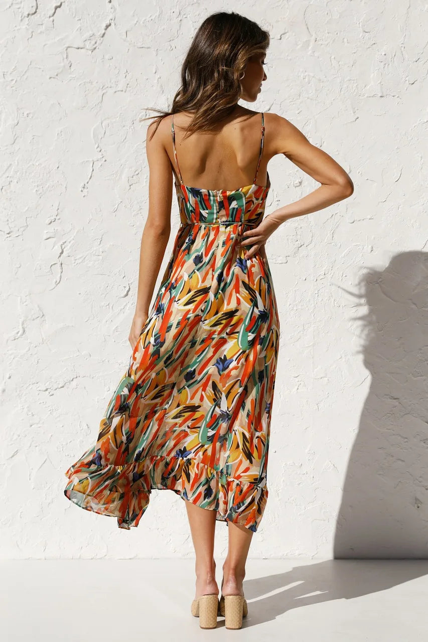 Robe fluide orange élégante de la marque Danoir Paris, design sophistiqué et tissu léger.