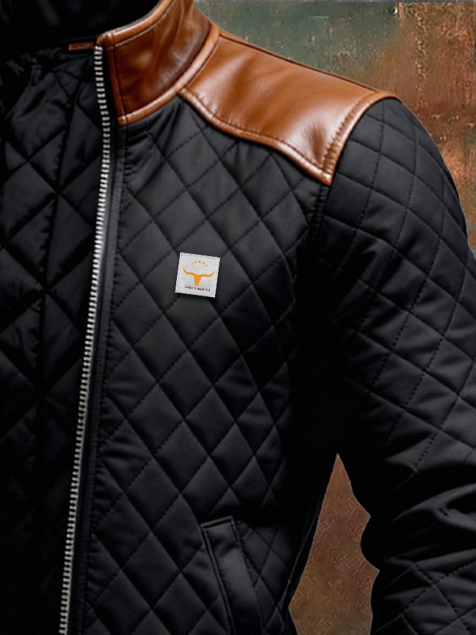Veste matelassée noire avec épaules en cuir de la marque Danoir Paris, style élégant et tendance pour femmes.