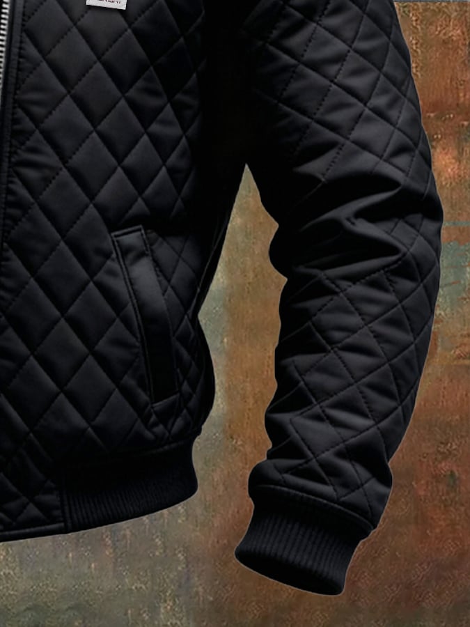 Veste matelassée noire Danoir Paris avec épaules en cuir, style élégant et moderne, vue de face sur fond neutre.