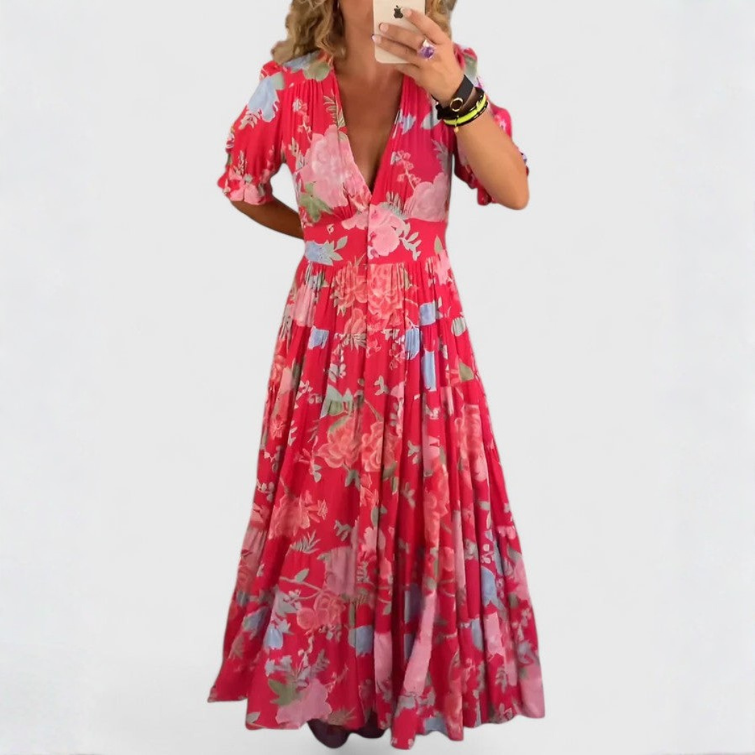Robe fleurie col V Minelda de Danoir Paris, tissu léger avec motif floral, portée élégante et féminine, vue de face.