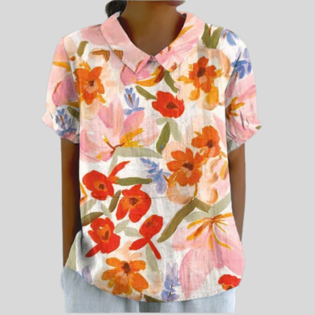 Blouse florale expressive Danoir Paris, avec motifs colorés, manches longues et coupe élégante, portée décontractée ou habillée.