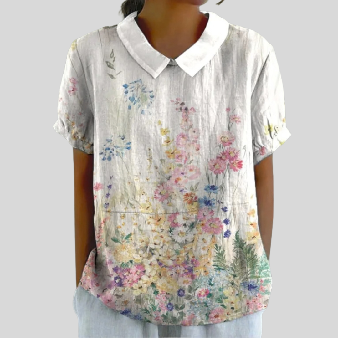 Chemisier Lysiane Danoir Paris avec motif floral jardin, manches longues et coupe élégante, vue front de la blouse.