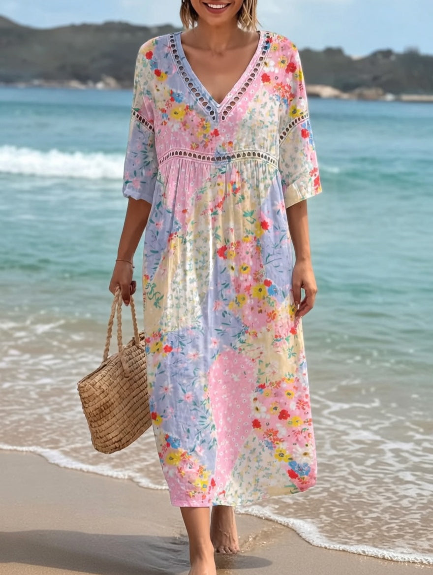 Robe fluide Lysiane™ à motif floral estival, longueur midi, manches courtes, tissu léger, par Danoir Paris.