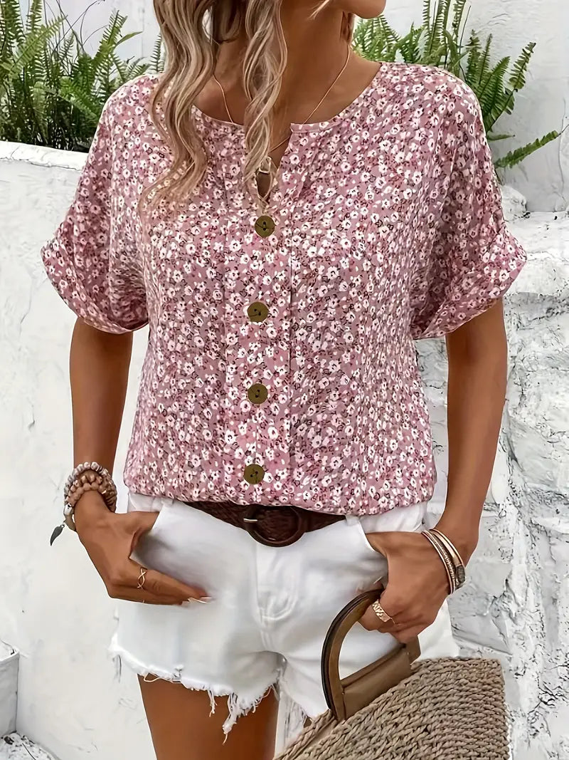 Robe estivale élégante Jelena de Danoir Paris avec motif floral coloré, longueur mi-mollet, style féminin et chic.