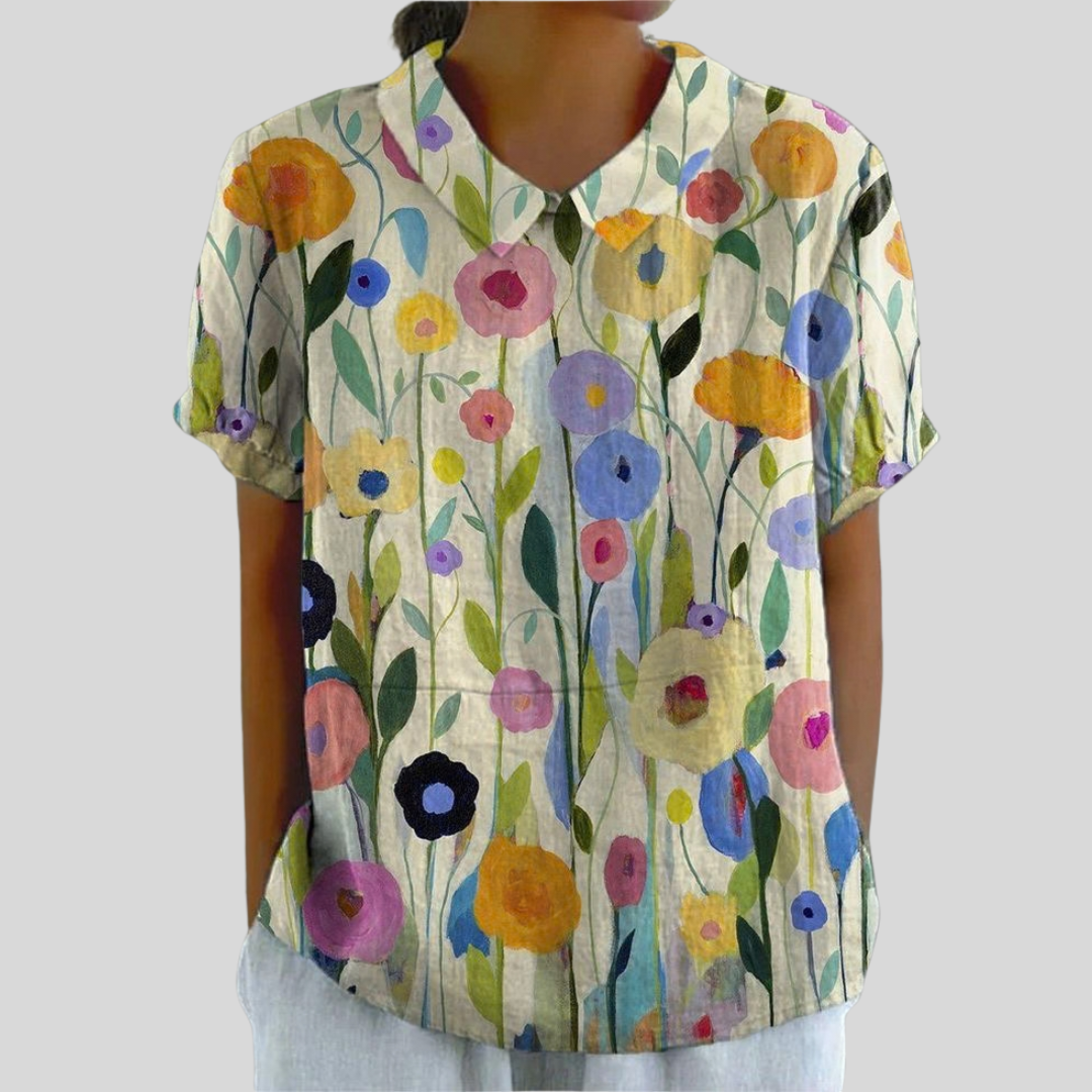 Blouse florale graphique Solène de Danoir Paris, tissu léger avec motif floral coloré, manches longues et coupe élégante.
