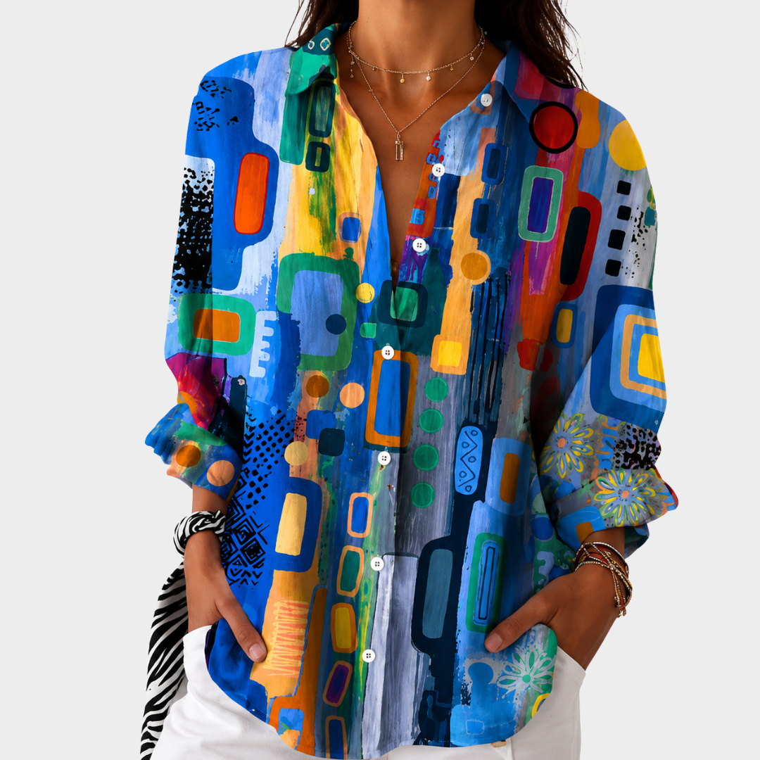 Blouse mosaïque vibrante Danoir Paris avec motif coloré et manches longues, portée élégante pour un style tendance.
