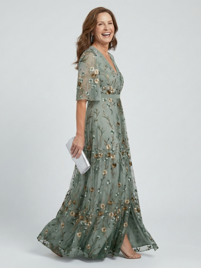 Robe longue maxi à bretelles halter avec motif floral coloré, marque Danoir Paris, style élégant et fluide.
