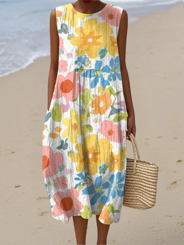 Robe midi sans manches Ella de Danoir Paris avec motif floral pastel, tissu léger et coupe élégante.