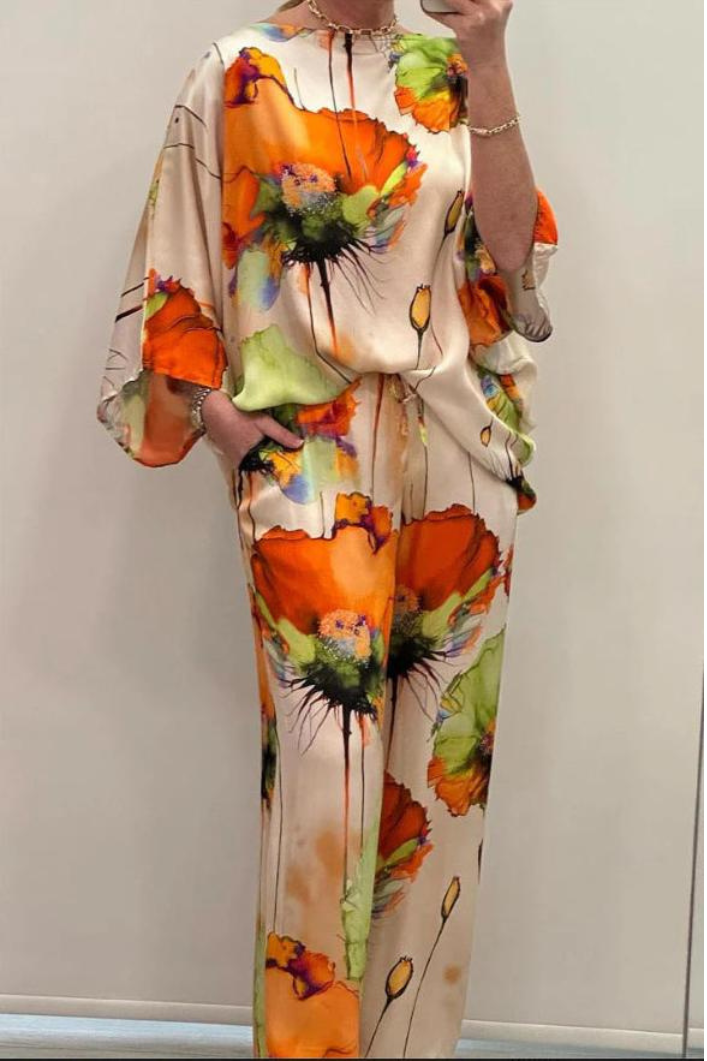 Costume élégant Danoir Paris en tissu orange tangerine, avec veste et pantalon pour un style polyvalent et sophistiqué.