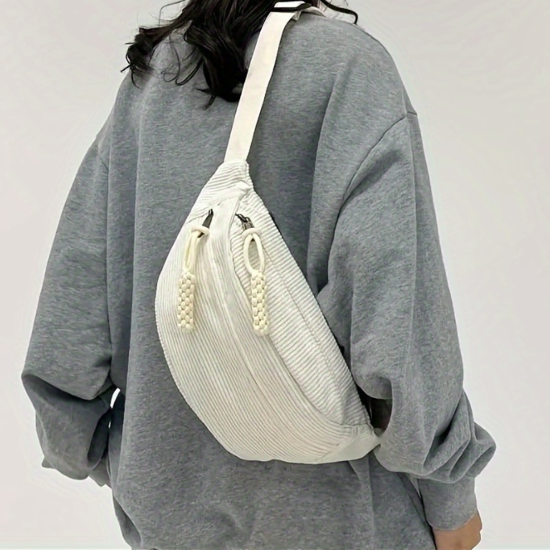 Sac à bandoulière Danoir Paris Petra en velours côtelé, couleur neutre, avec poignées élégantes et détails modernes.