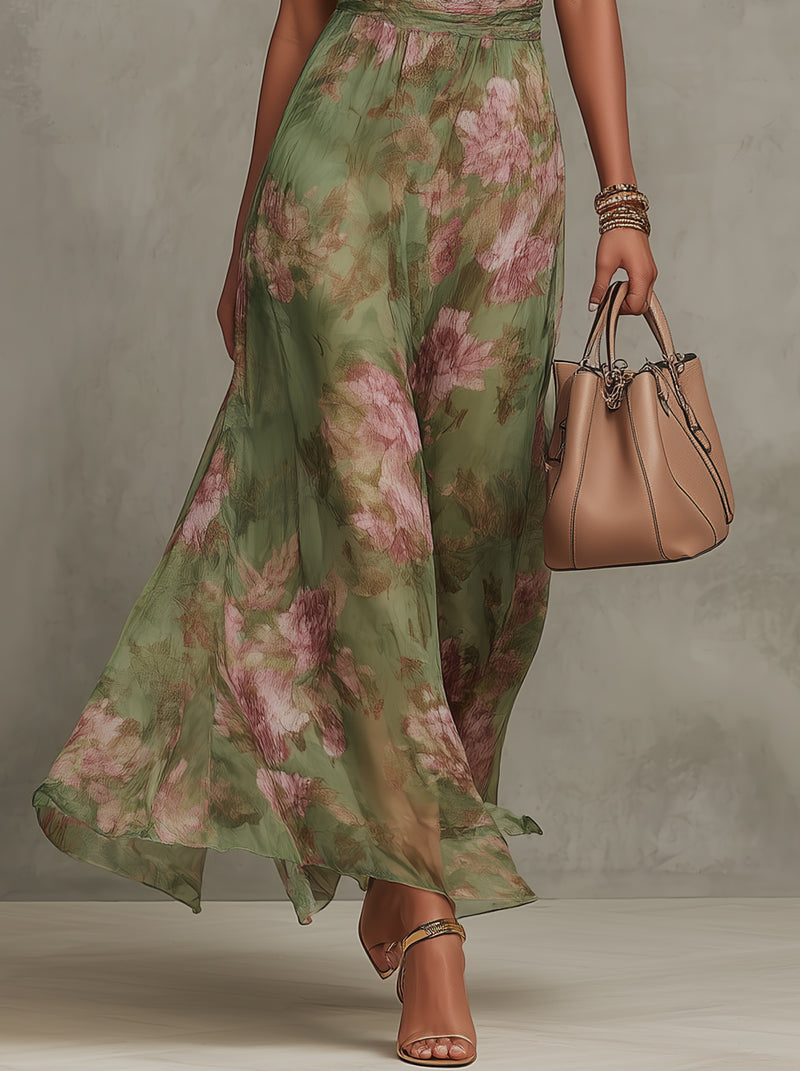Robe longue verte Danoir Paris Serena avec motif floral et col halter, vue de face sur mannequin.