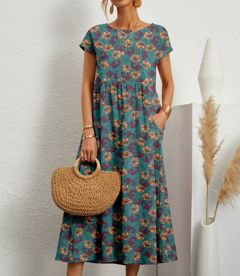 Robe florale élégante Deborah de Danoir Paris avec motifs colorés, tissu léger et coupe fluide visible sur l'image.