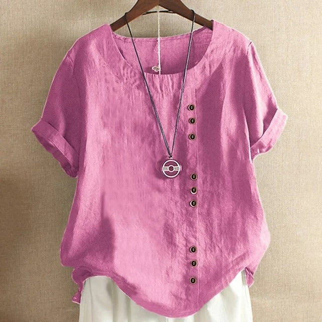 Chemisier aéré rose Estelle par Danoir Paris, tissu léger et chic, porté sur un mannequin avec détails de manches et col raffinés.