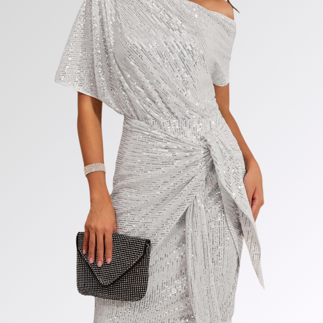Robe asymétrique scintillante Danoir Paris, en tissu brillant avec coupe moderne et design élégant, vue de face.