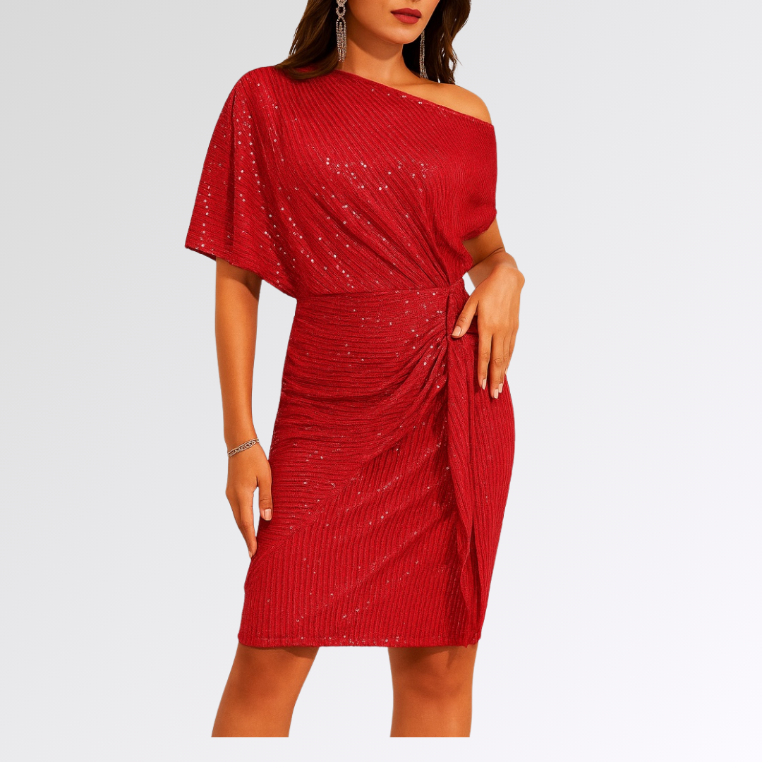Robe asymétrique scintillante Danoir Paris, vêtement élégant avec détails brillants et coupe moderne, portée pour une occasion spéciale.