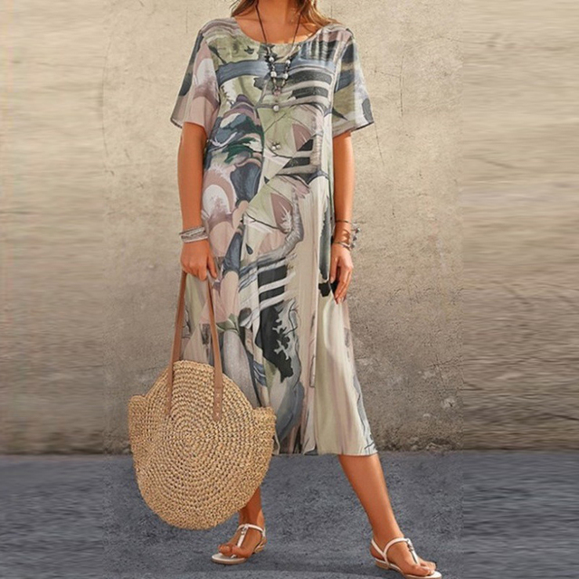 Tunique décontractée Jodilyn de Danoir Paris avec manches courtes, motif floral, longueur midi, style bohème pour femmes.