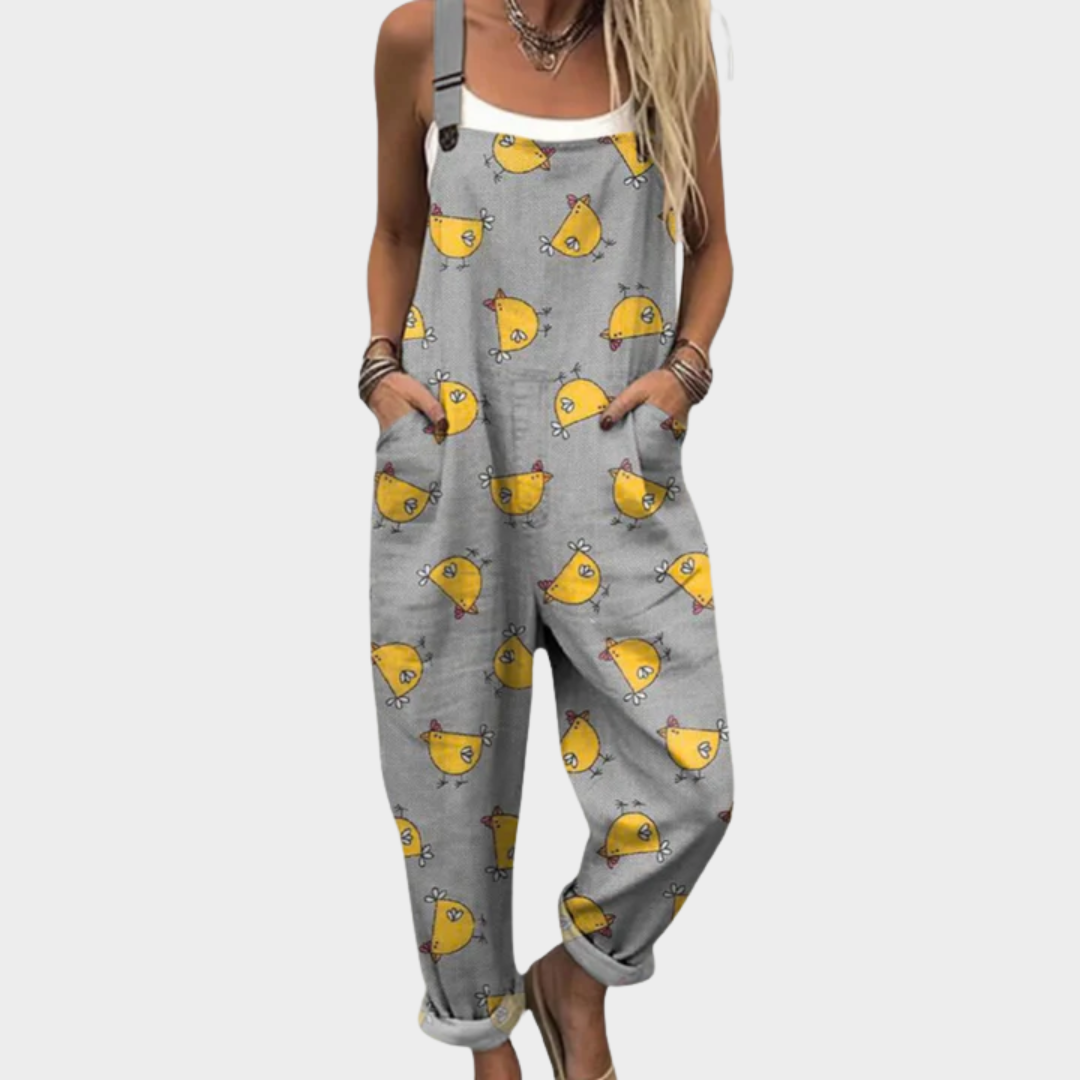 Salopette imprimée confortable de Danoir Paris, en tissu vert avec motif floral, ajustée à la taille et jambes longues.