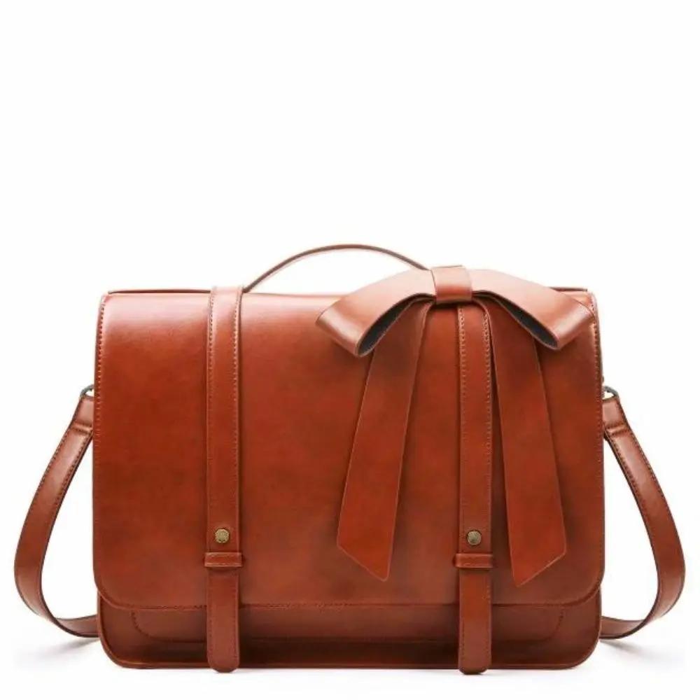 Sac rétro Danoir Paris Knoten Twist en bleu-rose avec poignée en cuir et design vintage élégant.