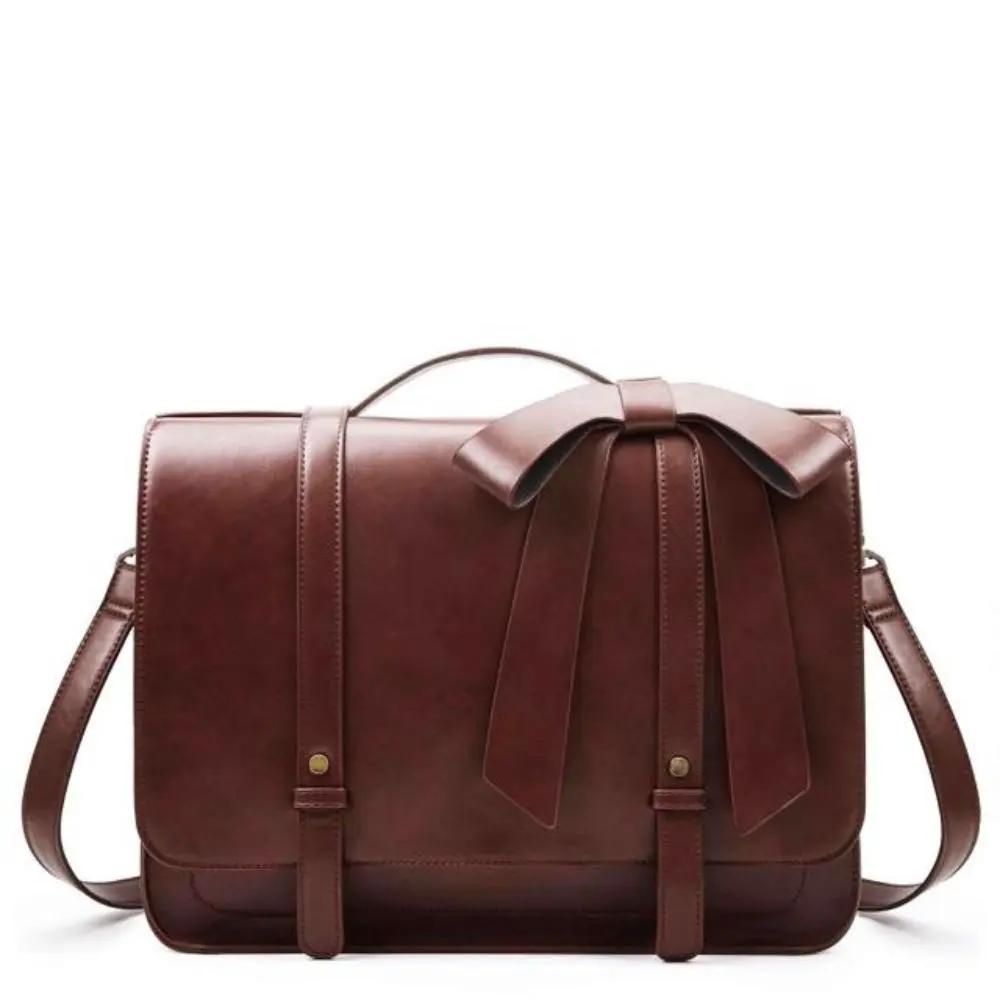 Sac rétro Danoir Paris Knoten Twist en bleu-rose, avec poignées en cuir et design vintage élégant, visible sur l'image.