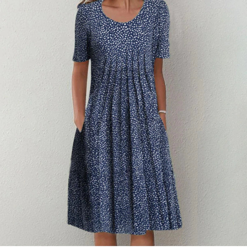 Robe midi aérée élégante Danoir Paris pour femme, tissu léger et fluide avec détails sophistiqués.