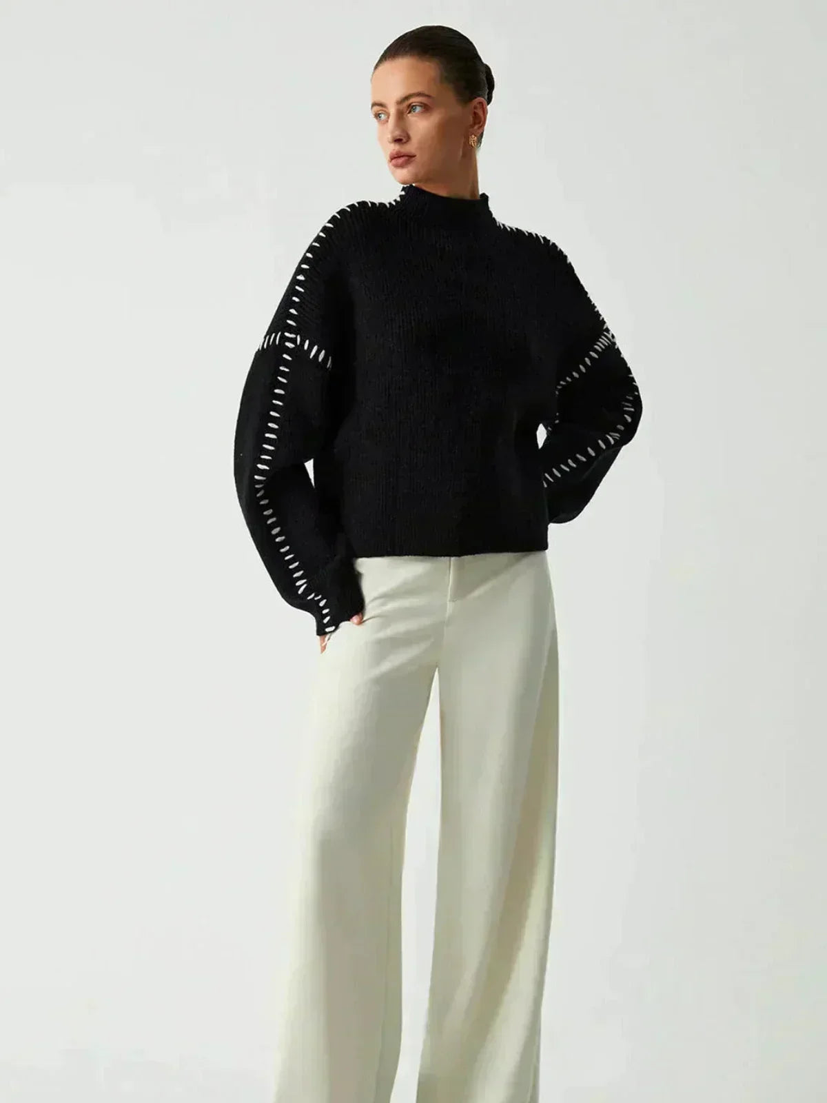 Pull en laine côtelée noir Danoir Paris, col montant avec surpiqûres, style automne confortable et tendance.