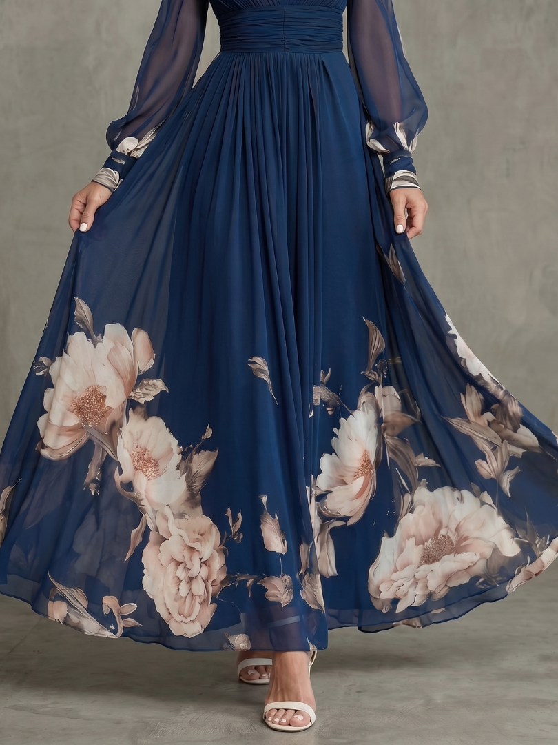 Robe maxi Danoir Paris à manches transparentes et ourlet floral, détail élégant avec motifs floraux et tissu léger.