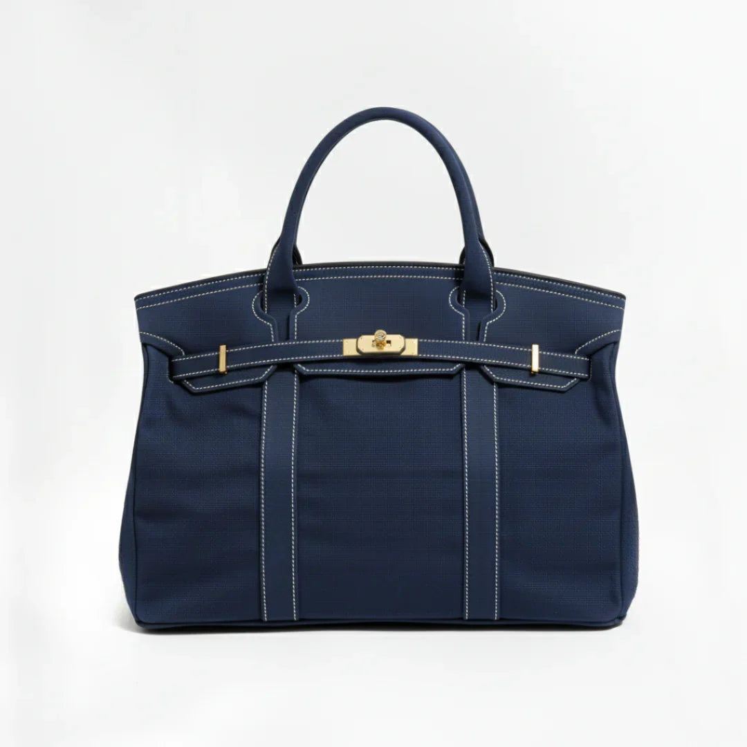 Sac de bateau Camille de Danoir Paris en bleu marine, avec poignée en cuir et design élégant pour un style maritime sophistiqué.