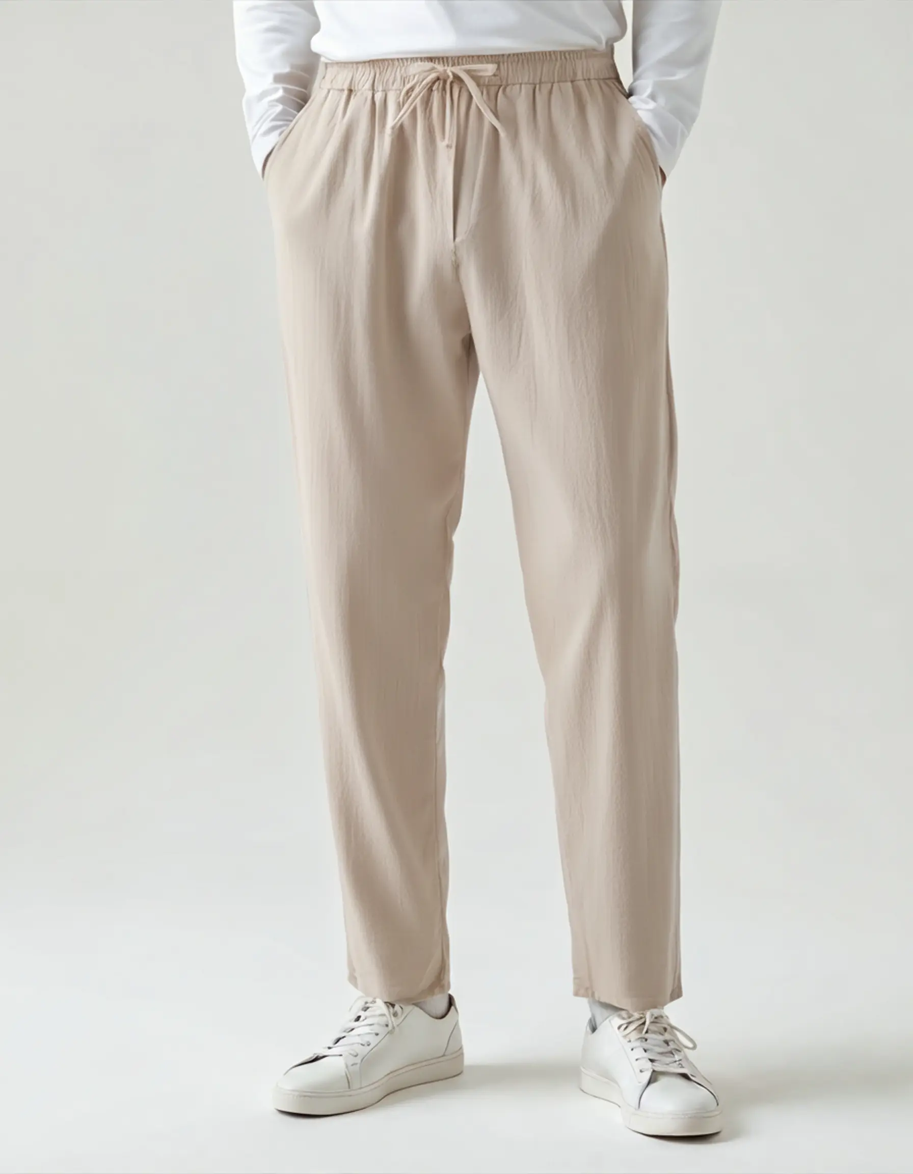 Pantalon en lin Zanzibar de la marque Old Money, coupe décontractée, couleur naturelle, détails de couture visibles.