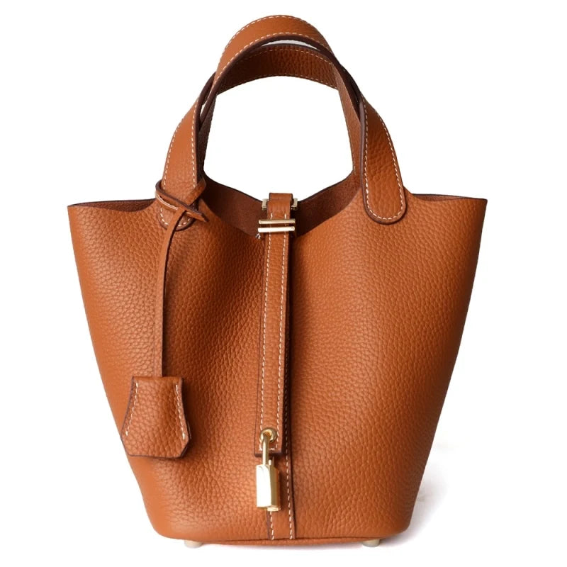 Sac seau orange Danoir Paris Portico avec poignée en cuir et design élégant, idéal pour un style moderne.
