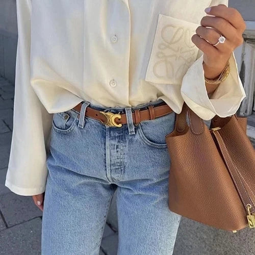 Sac seau Portico de Danoir Paris en orange, en cuir souple avec bandoulière ajustable et finition élégante.